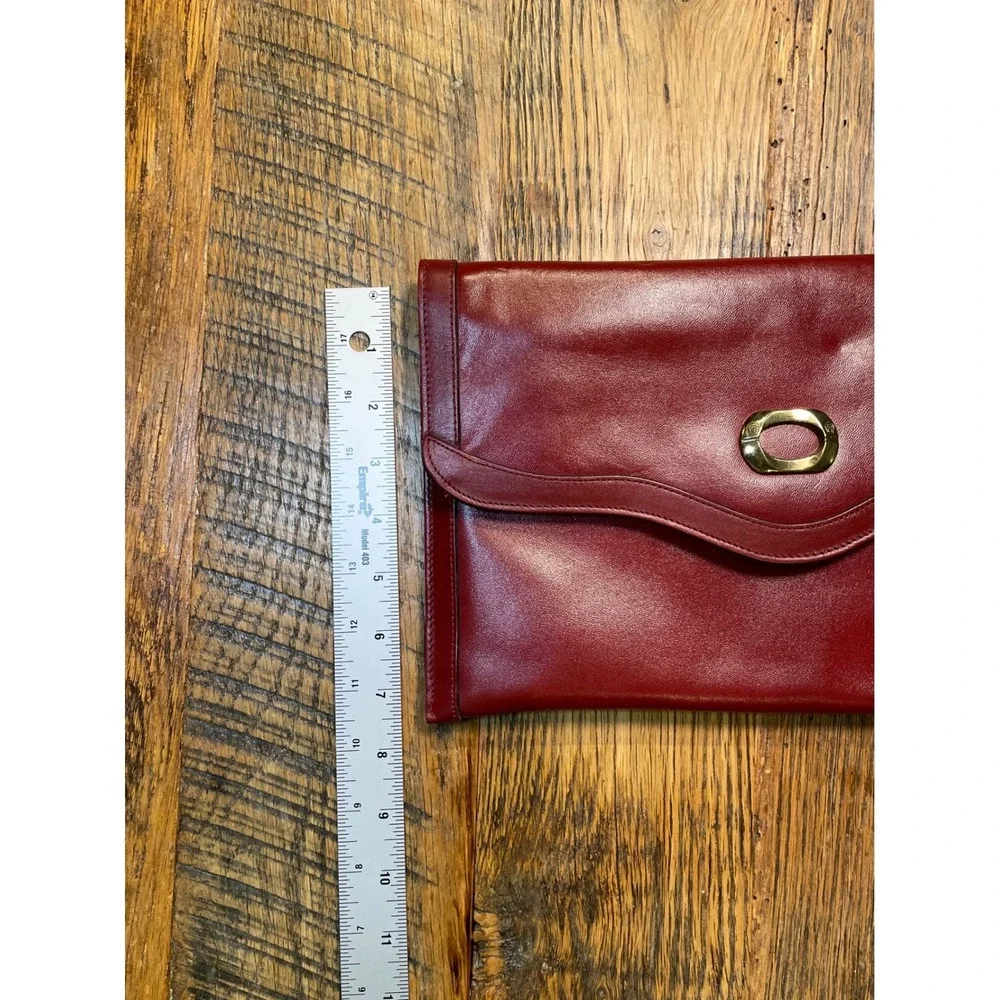 Elegant Burgundy Etienne Aigner Leather Clutch Handbag‎ with Gold Oval Accent